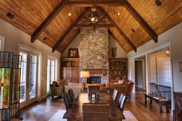 Ceiling-beams-in-interior-design-family-room-stone-fireplace-dining-area.jpg